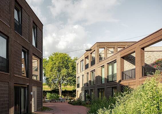 Referentiebeeld van een groene woonstraat