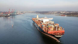 A big containership leaving the port loaded with containers