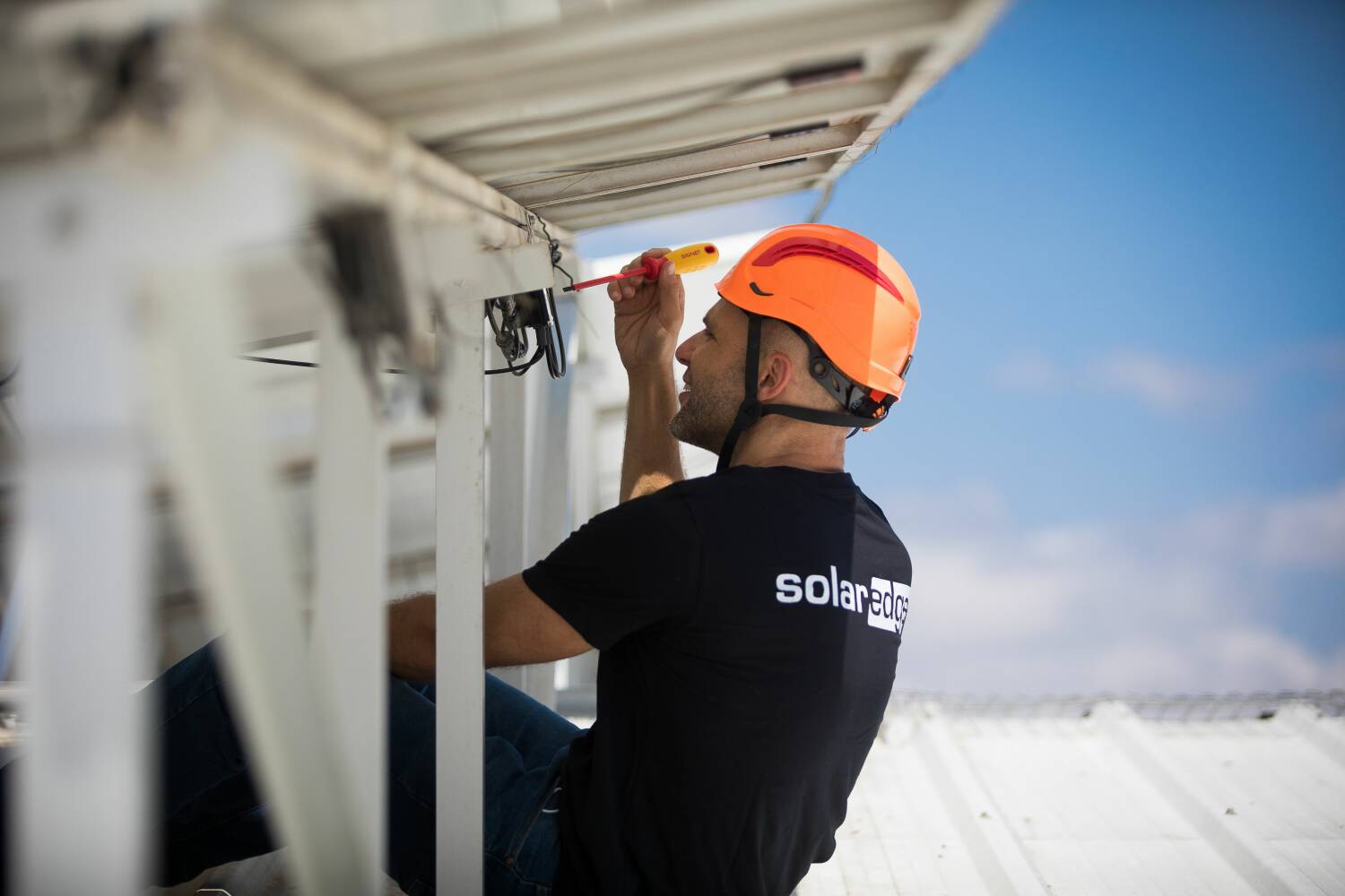 SolarEdge employee installing system