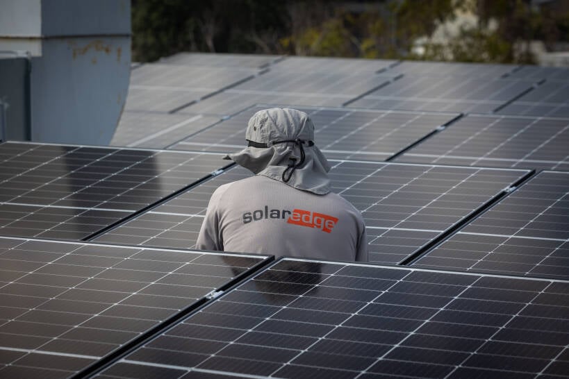 SolarEdge employee participating in community installation at women's shelter