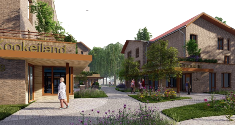 Foto van een oudere mevrouw in een rolstoel. Ze kijkt lachend naar de zorgmedewerker die haar duwt.