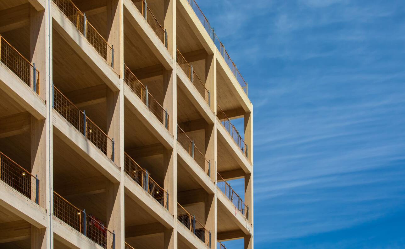 Building framed in wood against a blue sky