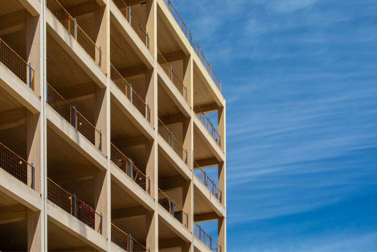 Building framed in wood against a blue sky