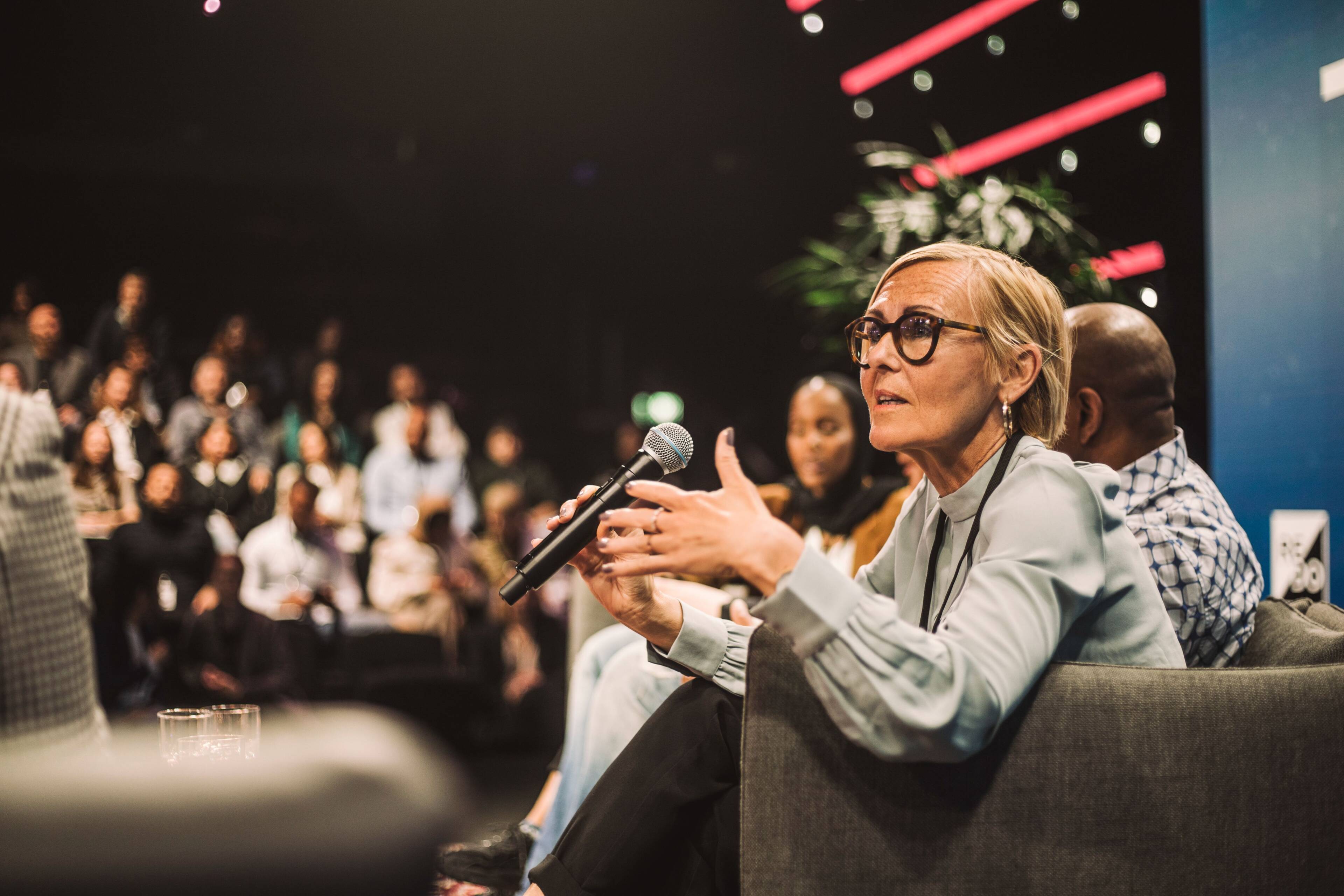 Photo of a female speaker at an event