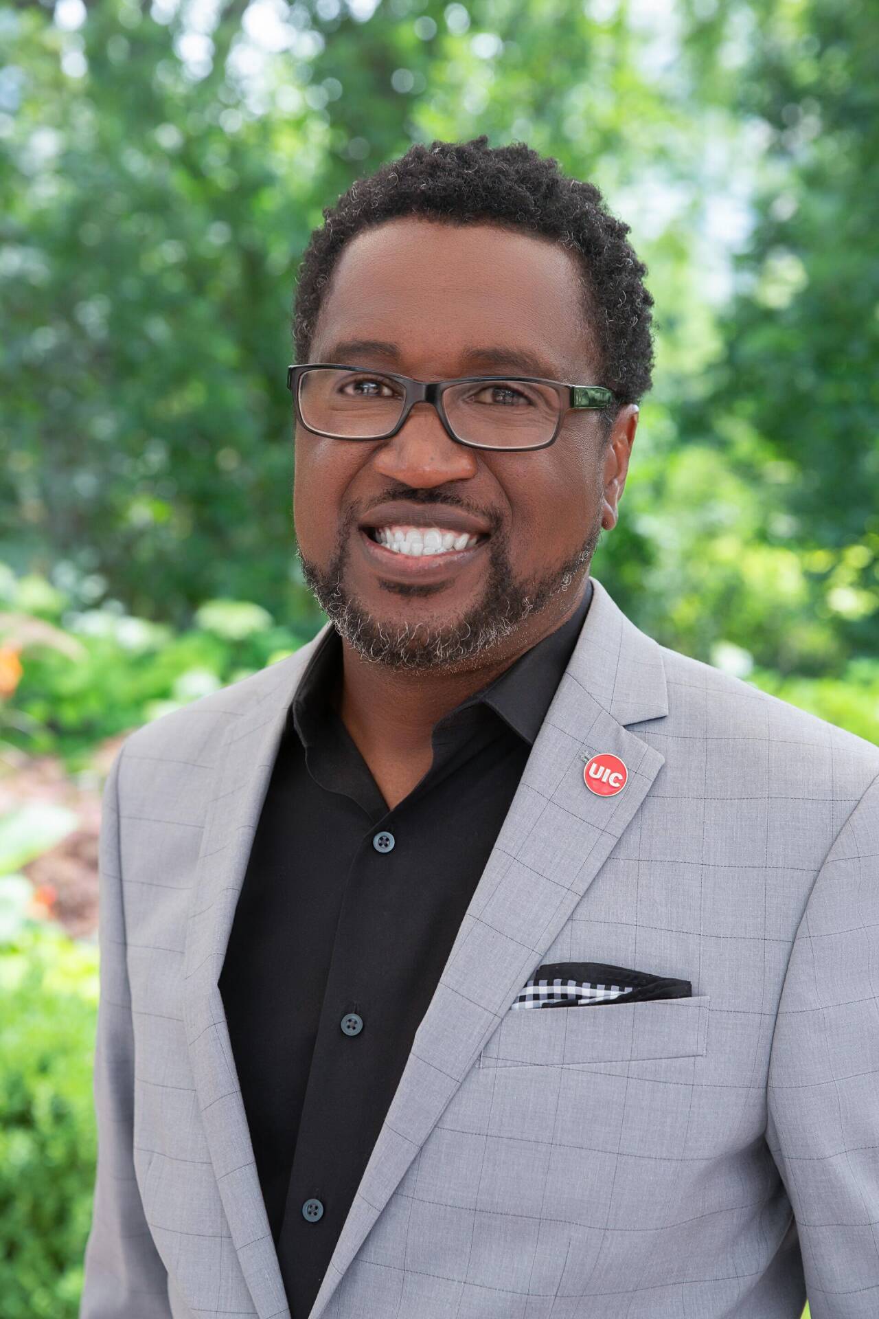 UIC alumnus Roddric Sims BA &rsquo;95 in a grey suit.