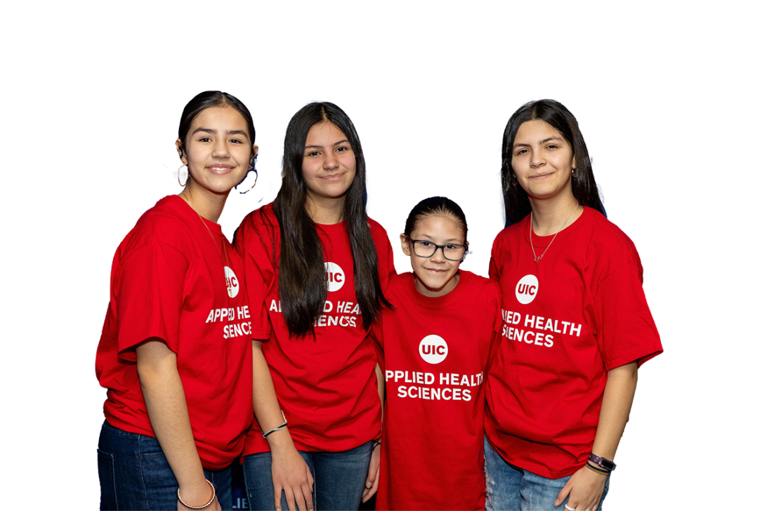 Four UIC students wearing red UIC Applied Health Sciences t-shirts
