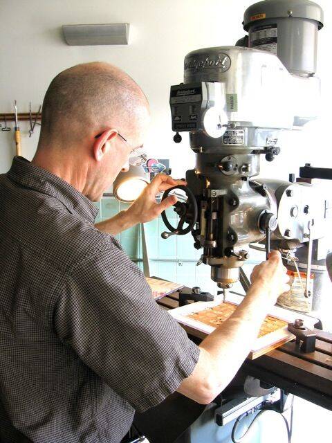 Man operating a microscope