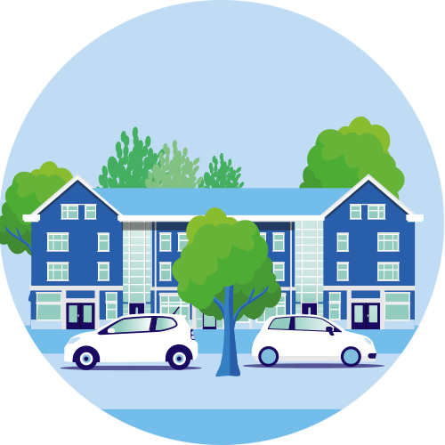 de afbeelding bevat een appartementencomplex  met op de voorgrond twee geparkeerde auto's