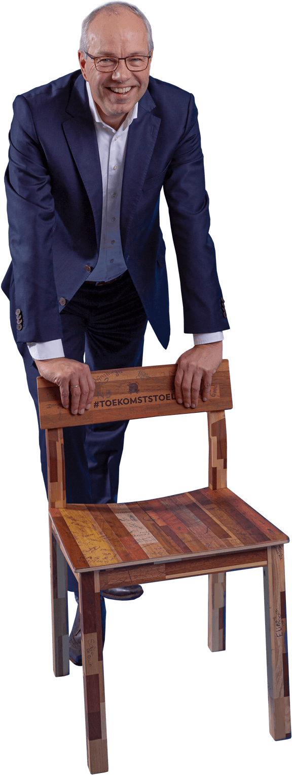 Cutout of CEO Pieter van Oord standing behind a chair